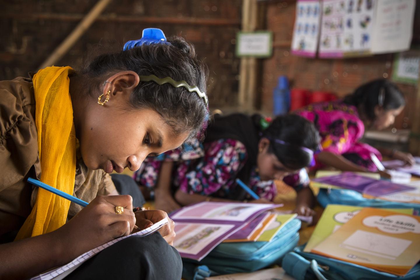 Children reading books in India
